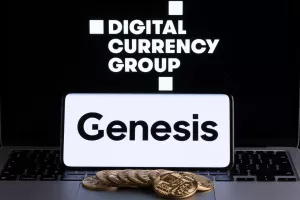 Genesis Global Trading crypto company logo seen on screen of smartphone with bitcoin tokens. Crypto lender owned by Digital Currency Group. Stafford, United Kingdom, November 22, 2022.
