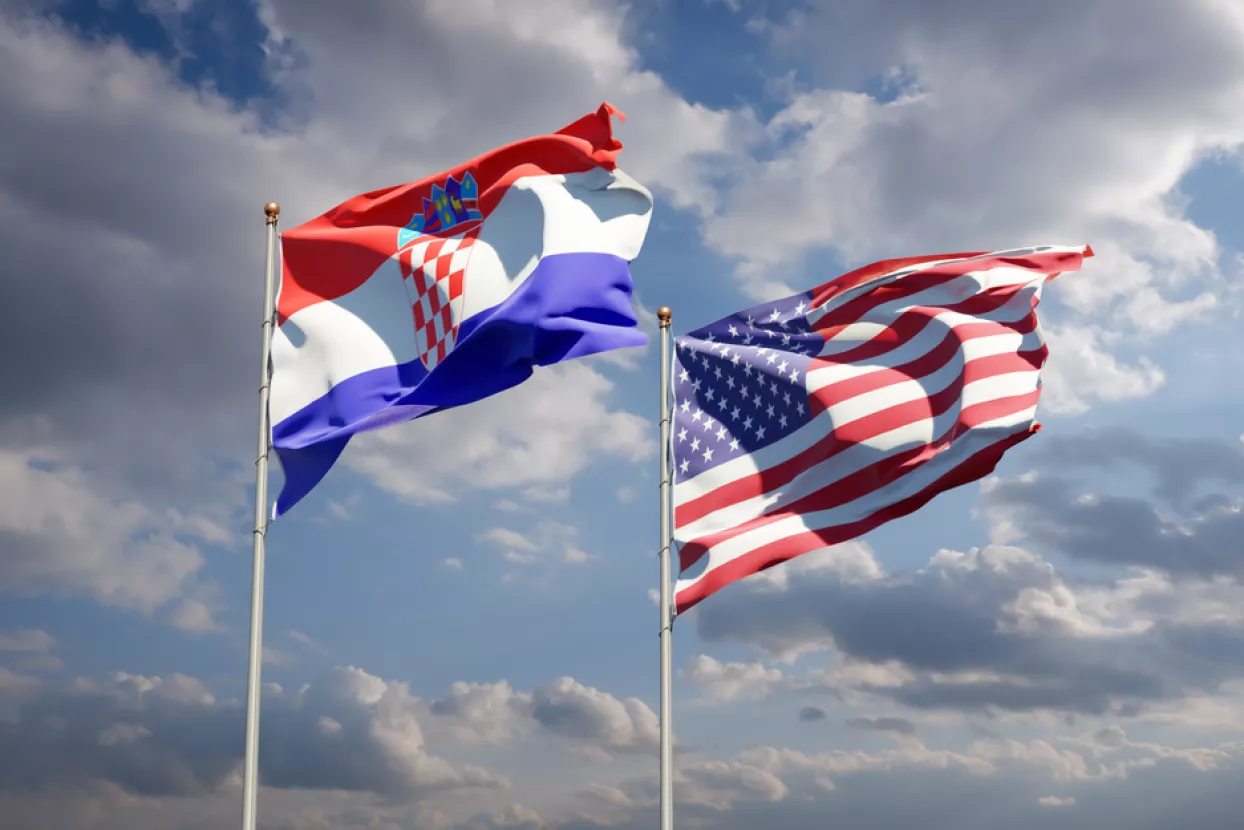 Beautiful national state flags of USA and Croatia together at the sky background. 3D artwork concept.