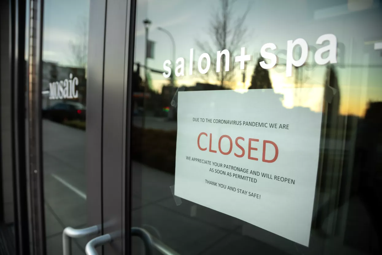 Kirkland, Washington/USA - March 19 2020Closed sign in the storefront of a hair salon during the COVID-19 pandemic