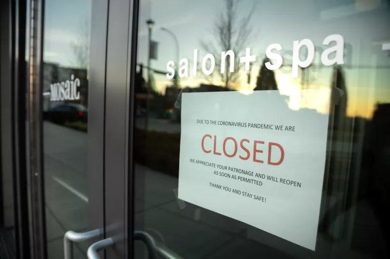 Kirkland, Washington/USA - March 19 2020Closed sign in the storefront of a hair salon during the COVID-19 pandemic