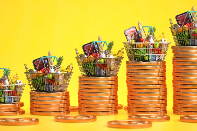 web-cijene, 16.1.2023.<br>Growth of food sales or growth of market basket or consumer price index concept. Shopping basket with foods with coin stacks on yellow background. 3d illustration
