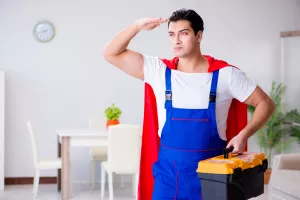 Superhero repairman with tools in repair concept