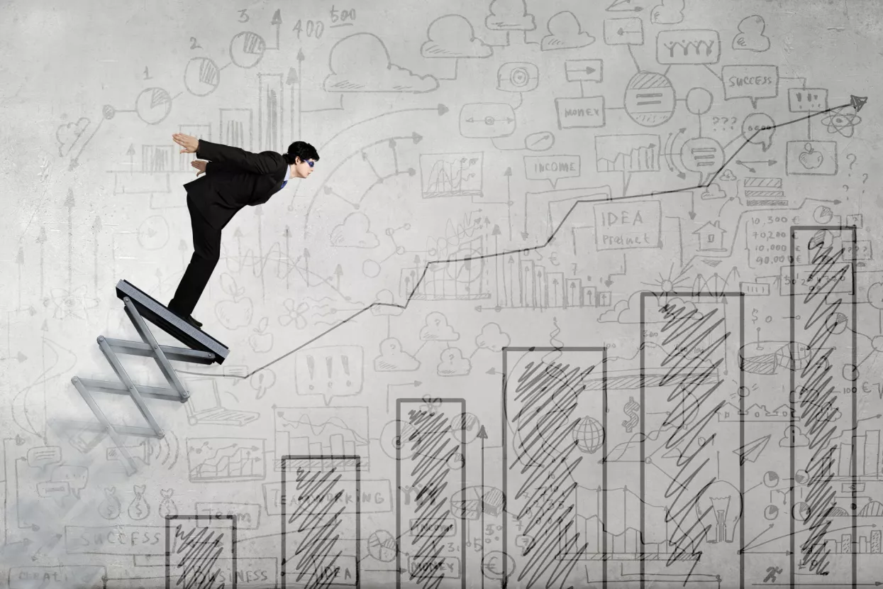 Businessman jumping on springboard as progress concept