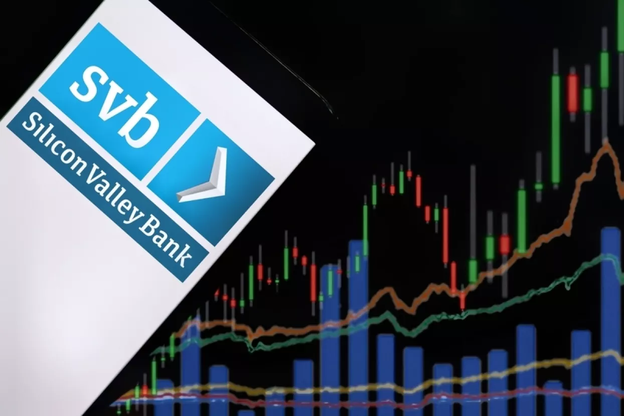 Jakarta - March 11,2023Silicon Valley Bank logo with stock market chart. Silicon Valley Bank (SVB) one of the largest banks in the United States and was the biggest bank in Silicon Valley