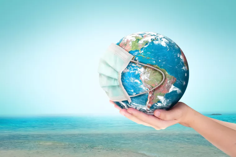 World Oceans Day conceptCorona virus or COVID-19 Earth wearing a mask, this image furnished by NASA