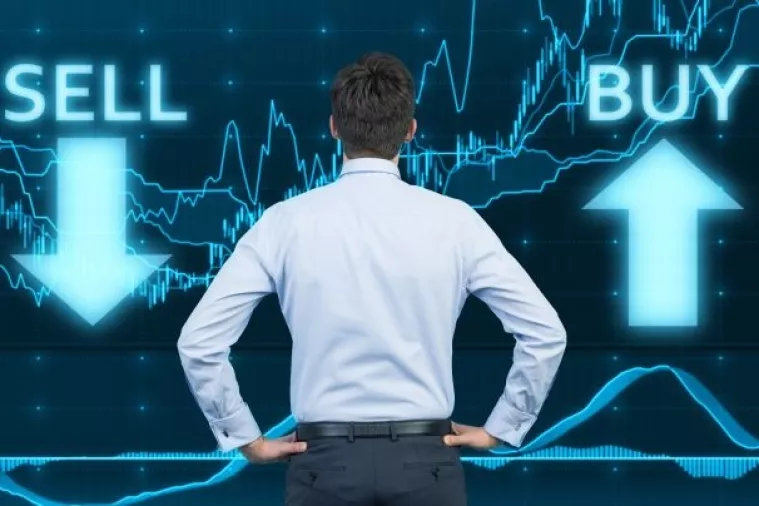 businessman looking to graph on virtual touchscreen