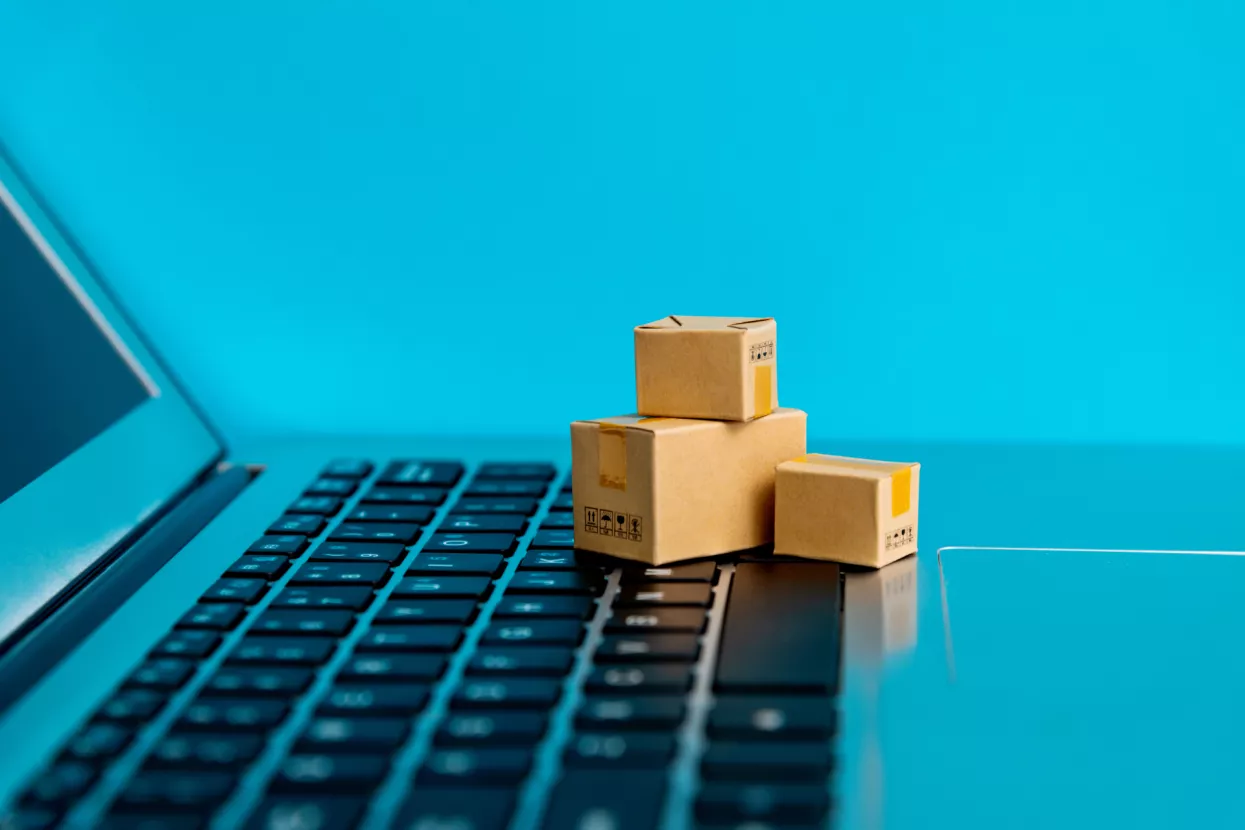 Small cartons on laptop keyboard.
