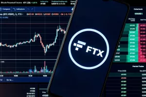 Kazan, Russia - Oct 28, 2021FTX is a cryptocurrency exchange. A smartphone with the FTX logo on the background of the live trading webpage. FTX dashboard.