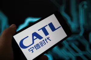 Viersen, Germany - May 9. 2021Closeup of phone screen with logo lettering of battery manufacturer CATL, blurred power circuit background (selective focus on center of letter T)