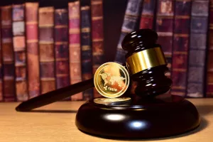 Judge hammer and XRP crypto coin. Justice courtroom. Ripple demands Bitcoin and Ethereum docs from SEC amid legal fight. Delist Ñ�ryptocurrency trading. Exchanges and traders. law to ban blockchainripple SEC