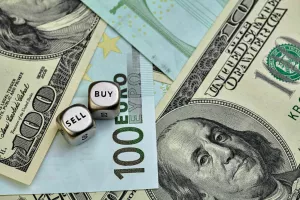 EURO, USD banknotes and dices cubes. Selective focus