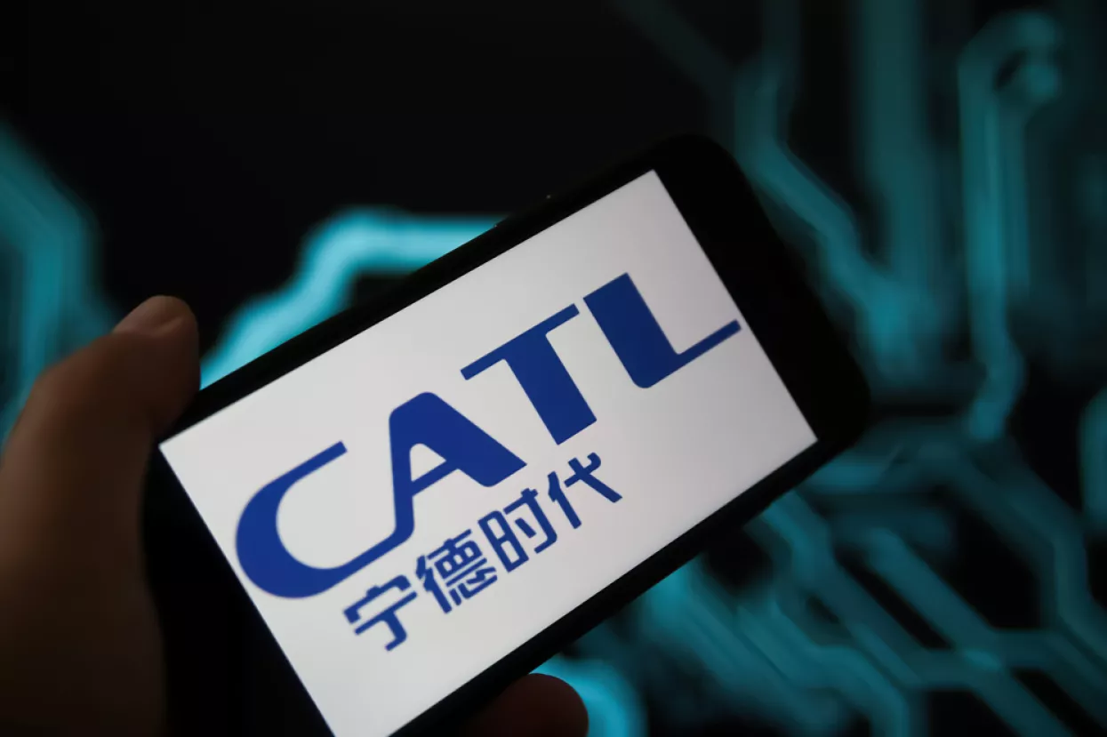 Viersen, Germany - May 9. 2021Closeup of phone screen with logo lettering of battery manufacturer CATL, blurred power circuit background (selective focus on center of letter T)
