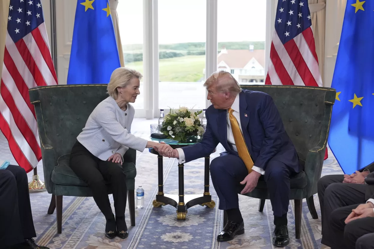 President Donald Trump shakes hands with European Commission President Ursula von der Leyen as they meet at the Trump Turnberry golf course in Turnberry, Scotland Sunday, July 27, 2025. (AP Photo/Jacquelyn Martin)