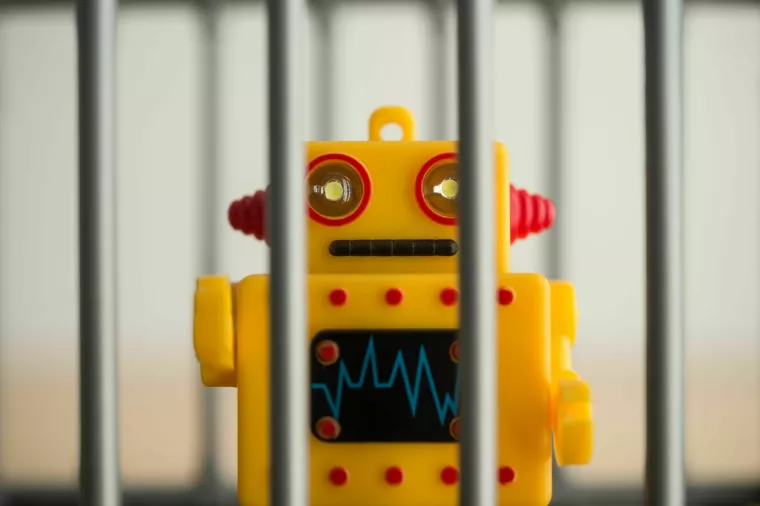 Close up AI artificial intelligence bot in jail  
