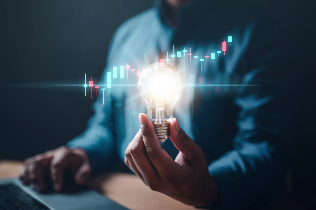 chart, graph, invention, bulb, invest, leadership, marketing, solution, strategy, glowing. A person is holding a light bulb. Concept of innovation and creativity with new ideas and inventions.