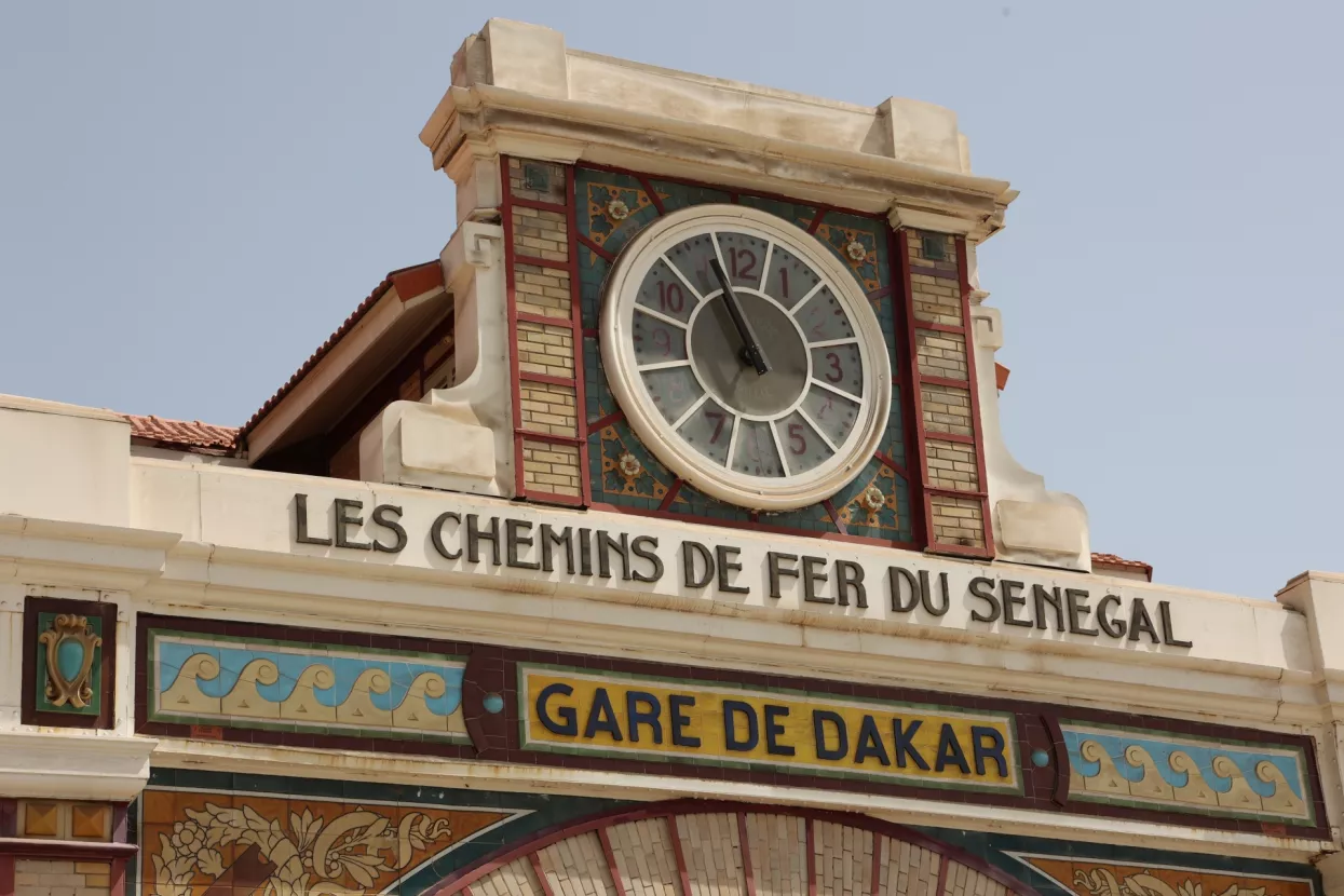Plateau Dakar Senegal, 4 may 2024 Front outdoor view of the renovated historical railway station of Dakar located on the Plateau. Main entrance of the building with a blue sky in background.
